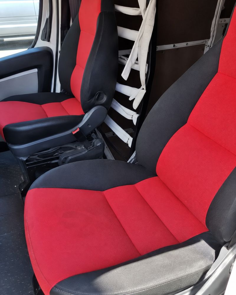 Same van seats bright red and clean after mobile valet