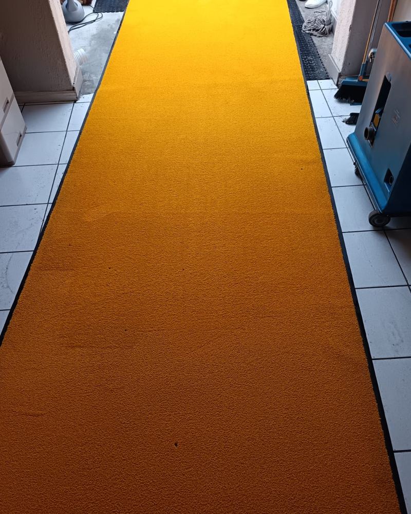 Same yellow entrance runner bright and stain-free after deep cleaning